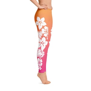 Peut inclure: Un legging rose et orange avec un motif floral blanc. Le legging a un dégradé qui passe de l'orange au rose.