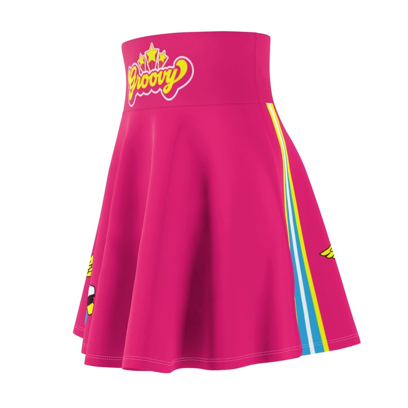 May include: A pink skirt with a high waist and a yellow and blue stripe down the side. The skirt has a yellow "Groovy" graphic with stars on the front.