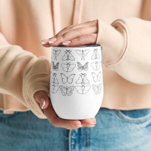 White Butterflies Wine tumbler