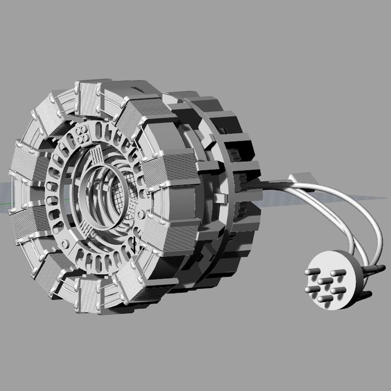 May include: A silver-colored, 3D printed model of a fictional device with a circular, multi-layered design and a cord with a connector on the end.