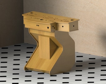 May include: A wooden arcade cabinet with a control panel featuring multiple buttons and a joystick. The cabinet is made of light brown wood and has a unique curved design.