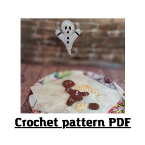 May include: Crochet pattern PDF for a ghost and gingerbread man. The ghost is white with black eyes and a black mouth. The gingerbread man is brown with white icing and red candy.