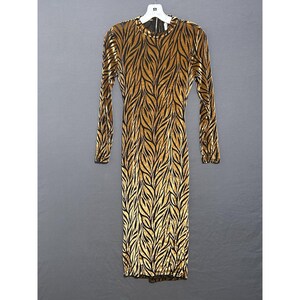 May include: A long, floor-length dress with long sleeves, featuring a gold and black leaf pattern. The dress is made of a velvet-like fabric and hangs on a white hanger against a grey background. It has a round neckline and a back zipper.