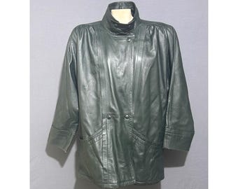 May include: Dark green leather jacket with a high collar and button closure. The jacket has a classic design with two front pockets and three-quarter length sleeves. The jacket is displayed on a mannequin.