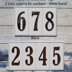 May include: Two sets of house numbers, each with a white frame and black or brown numbers. The numbers are 4.25 inches high. The top set shows the numbers 678 in black, and the bottom set shows the numbers 2345 in brown.