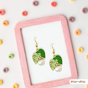 Monstera plant leaf dangle earrings with enamel charms and 18k gold-plated hooks, perfect for plant ladies and nature lovers.