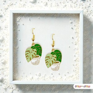 Monstera plant leaf dangle earrings with enamel charms and 18k gold-plated hooks, perfect for plant ladies and nature lovers.
