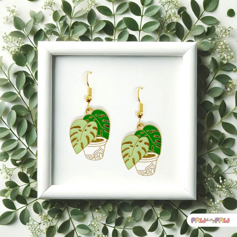 Monstera plant leaf dangle earrings with enamel charms and 18k gold-plated hooks, perfect for plant ladies and nature lovers.