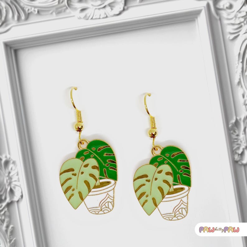 Monstera plant leaf dangle earrings with enamel charms and 18k gold-plated hooks, perfect for plant ladies and nature lovers.