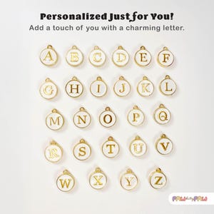 May include: White round charms with gold letters of the alphabet A through Z.  Personalized Just for You! Add a touch of you with a charming letter.