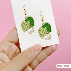 Monstera plant leaf dangle earrings with enamel charms and 18k gold-plated hooks, perfect for plant ladies and nature lovers.