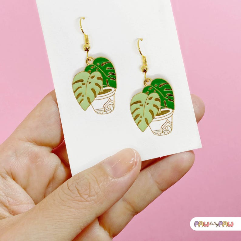 Monstera plant leaf dangle earrings with enamel charms and 18k gold-plated hooks, perfect for plant ladies and nature lovers.