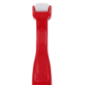May include: A red plastic roller with a white roller head. The roller is used for applying paint or other materials.