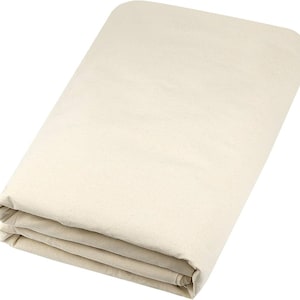 May include: A folded piece of off-white fabric, possibly cotton or linen. The fabric is neatly folded, forming a rectangular shape. The neutral colour and simple design suggest a versatile textile suitable for various applications.