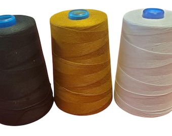May include: Three spools of thread in black, gold, and white, each with a blue top. The spools are tightly wound, showcasing the thread's texture. Ideal for sewing, embroidery, or other textile crafts.