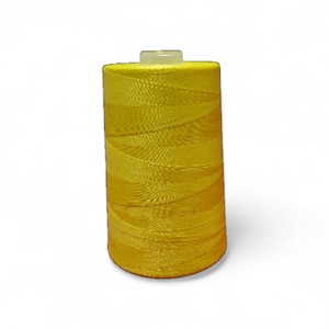 May include: A vibrant yellow thread spool, cylindrical in form. The thread is tightly wound, creating a solid colour. A small, white plastic piece is at the top. Suitable for sewing, embroidery, and various craft projects. The thread is measured in meters.