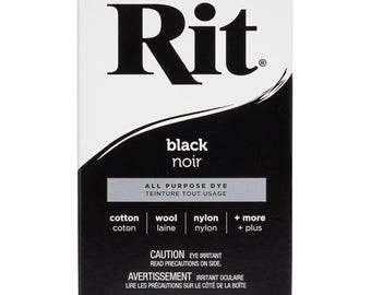May include: A box of Rit black dye for all-purpose use. The box is white with black text and a black and silver design. The dye is suitable for cotton, wool, nylon, and more. The box contains 31.9 grams or 1-1/8 ounces of dye.