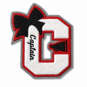 May include: A letter C patch featuring white chenille fabric with a red border and a grey felt backing. A black embroidered bow is attached to the top left, and the word Captain is stitched in black script. A black megaphone icon is present.