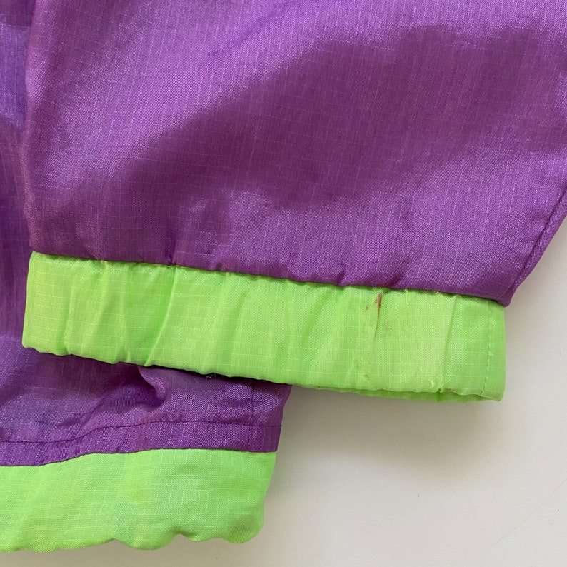 columbia radial sleeve pullover windbreaker jacket adult small 90s purple green neon hooded lightweight coat rare mens vintage clothing