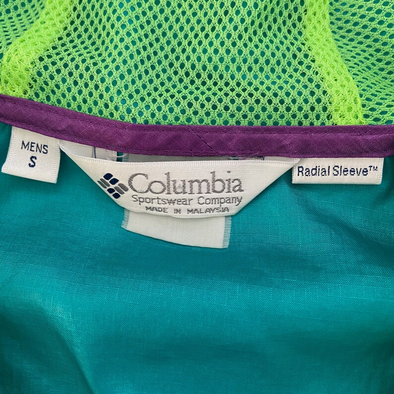 columbia radial sleeve pullover windbreaker jacket adult small 90s purple green neon hooded lightweight coat rare mens vintage clothing