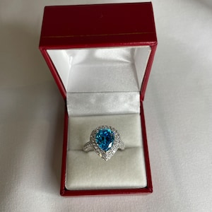 Rhodium over sterling silver blue Luce teardrop white simulant diamond ring