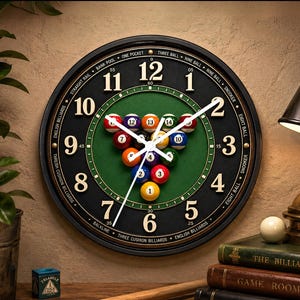 May include: A round wall clock with a black frame and a green felt center featuring a rack of colorful billiard balls. The clock face displays large white numerals and text listing various billiards games like Nine Ball and Snooker.