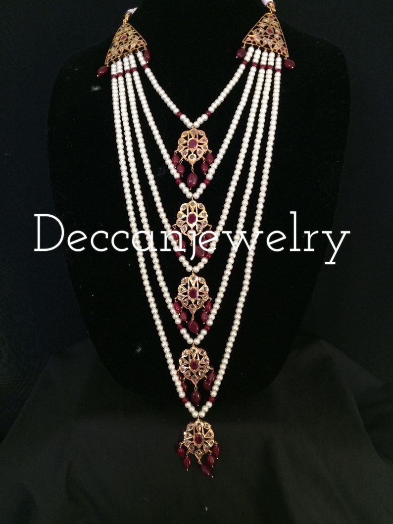 indian jewellery Soha hyderabadi jadau Satlada with earrings in rubies