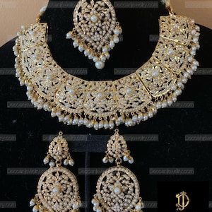 Chriselle jadau necklace with earrings and tika in pearls , Indian jewellery