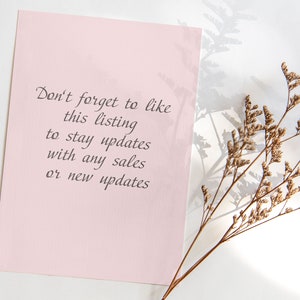 May include: A light pink rectangular card with the text "Don't forget to like this listing to stay updates with any sales or new updates" in dark grey script. A dried plant stem with small brown flowers is in the background.