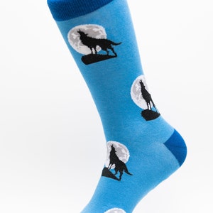 May include: Blue socks with a pattern of howling wolves silhouetted against a full moon.