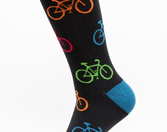 May include: Black sock with a blue cuff and toe, patterned with colorful bicycles. The bicycles are in orange, green, red, and blue. The sock is displayed against a white background.