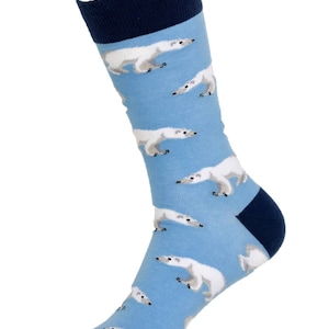 May include: A pair of blue socks with a white polar bear pattern. The socks have a navy blue cuff.