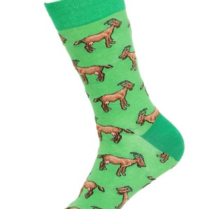 May include: Green socks with a brown goat pattern. The goats are brown with pink udders and are repeated throughout the sock.