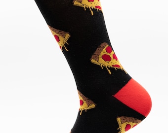 May include: A pair of black socks with a red cuff and a pizza slice pattern. The socks are on a white background.