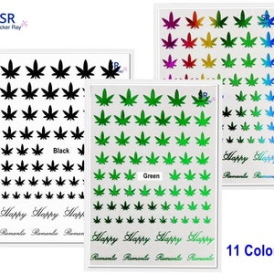 May include: A sheet of 11 different coloured marijuana leaf stickers. The stickers are arranged in rows and columns. The colours include black, green, red, orange, yellow, blue, purple, and pink. The text "Happy Happy Romantio Romantio" is printed at the bottom of the sheet.
