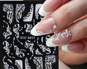Pegatinas de uñas blancas con relieve 5D con motivos florales: Flores abstractas, ramas, puntos y líneas.