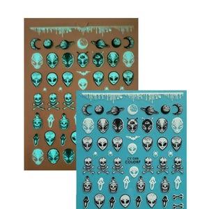 May include: Two sheets of nail art stickers featuring alien heads, planets, moons, skulls, and other spooky designs. One sheet is on a brown background, and the other is on a blue background. The stickers have a glow-in-the-dark effect.