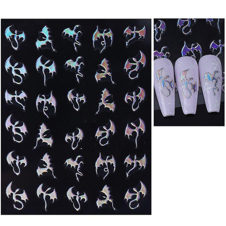 May include: Sheet of iridescent dragon nail art stickers on a black background. The stickers are in various poses and have a holographic effect. Three nails are shown with the dragon stickers applied.