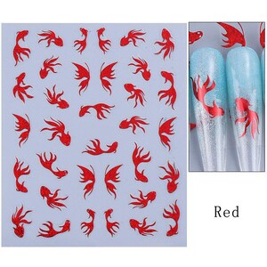 May include: Sheet of red fish nail art stickers. The stickers feature various fish designs, including full fish and fish silhouettes. The image also shows two nail tips with a red fish design on a blue and silver background. The word "Red" is in the bottom right corner.