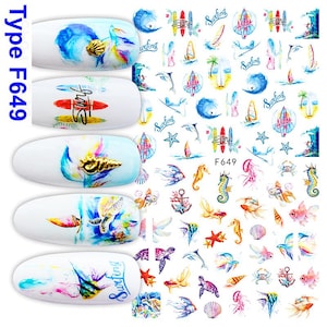 May include: Nail art stickers featuring a variety of ocean-themed designs. The stickers include images of seashells, surfboards, seahorses, and turtles. The nail art stickers are white with colorful illustrations and the text "Surfing".
