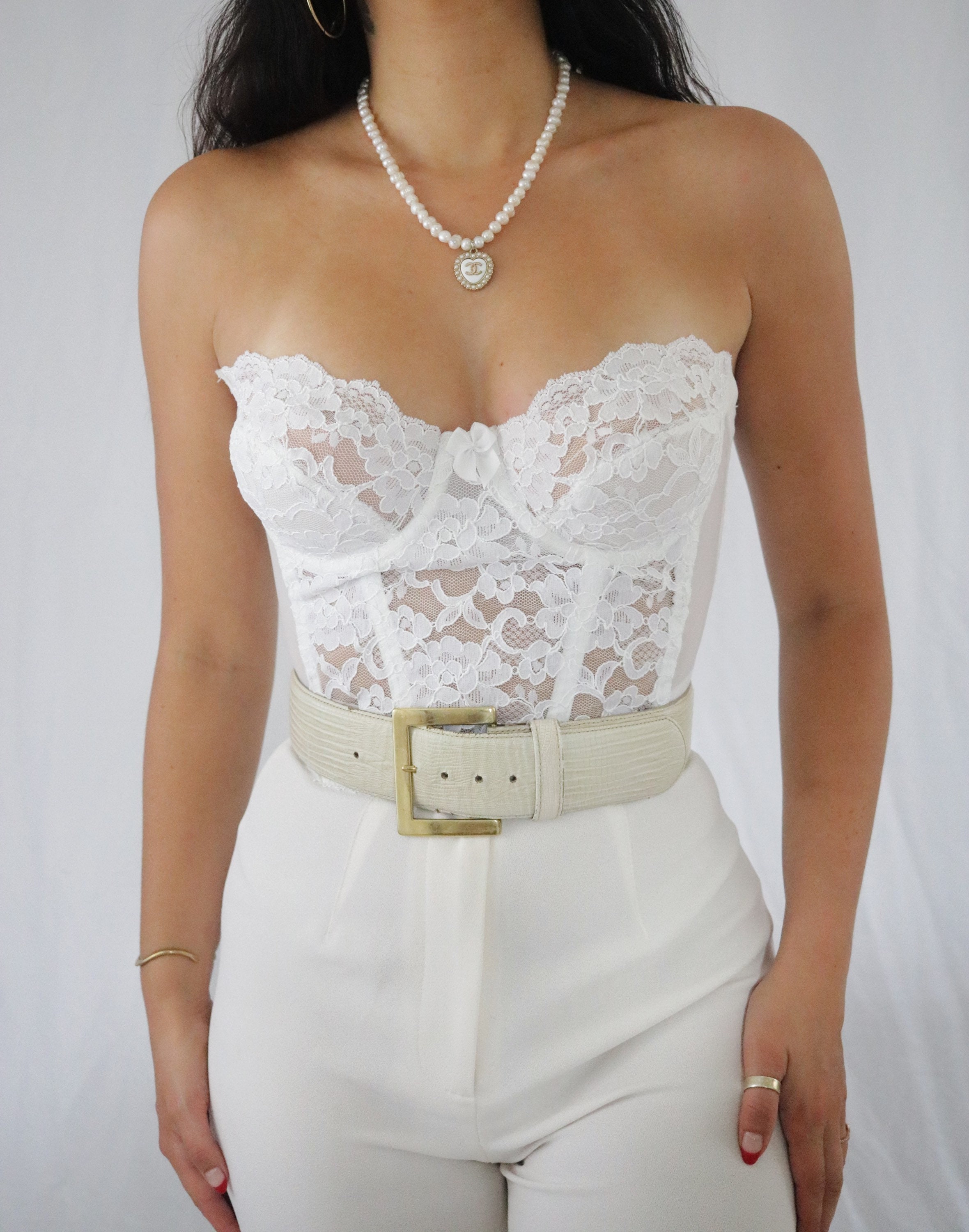 White corset top with lace and bow stitching  White corset top, White lace  corset, Victoria secret corsets