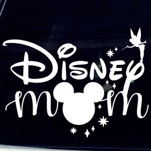 May include: White vinyl decal with the text "Disney Mom" and a Mickey Mouse head silhouette. A fairy with wings is flying above the text.