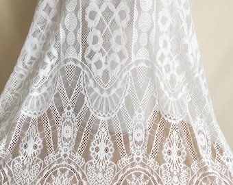 May include: White lace fabric with a delicate floral pattern. The lace has a scalloped edge and a fine mesh texture.