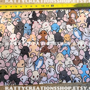 May include: Rectangular mouse pad featuring a repeating pattern of cartoon mice in various colors, including gray, brown, blue, and pink. The mouse pad measures approximately 11 inches in length. The text "RATTY CREATIONS" and "RATTYCREATIONSSHOP.ETSY.COM" are visible.