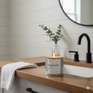 image of a candle burning in a modern farmhouse chic bathroom