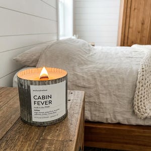 May include: A rustic wooden sign with the text "Welcome to our home" in white lettering. The sign features a distressed finish and a simple, inviting design, perfect for a front porch or entryway.