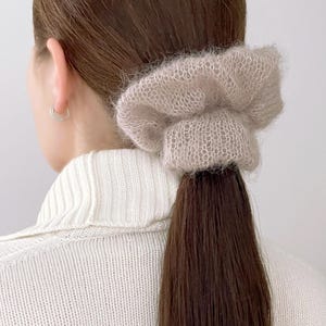 Kid mohair and silk yarn scrunchie in natural light
