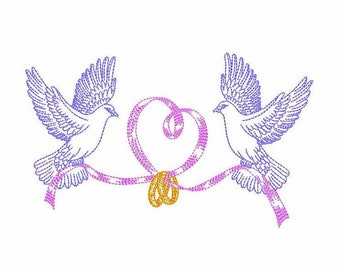 May include: An embroidered design featuring two white doves with blue wings, facing each other. They are connected by a pink ribbon forming a heart shape, with two gold wedding rings at the center. The design is on a white background.