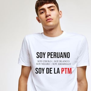 May include: White t-shirt with black text that reads "Soy Peruano" and "Soy de la PTM". The text also includes "Soy Cholo", "Soy Blanco", "Soy Negro", and "Soy Amarillo".