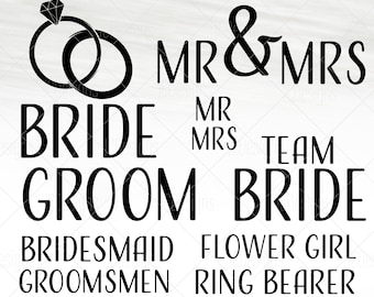 May include: Black and white wedding-themed design with the text "MR & MRS", "BRIDE", "GROOM", "TEAM BRIDE", "BRIDESMAID", "GROOMSMEN", "FLOWER GIRL", and "RING BEARER".